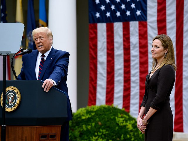 US President Donald Trump speaks next to Judge Amy Coney Barrett at the Rose Garden of the