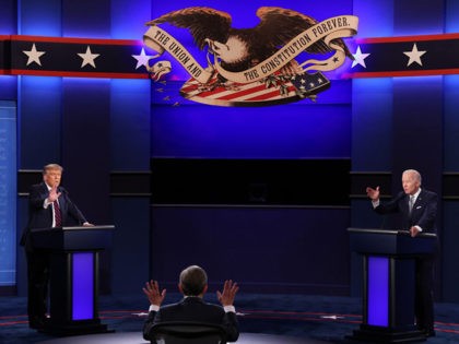 CLEVELAND, OHIO - SEPTEMBER 29: U.S. President Donald Trump and Democratic presidential nominee Joe Biden participate in the first presidential debate moderated by Fox News anchor Chris Wallace (C) at the Health Education Campus of Case Western Reserve University on September 29, 2020 in Cleveland, Ohio. This is the first …