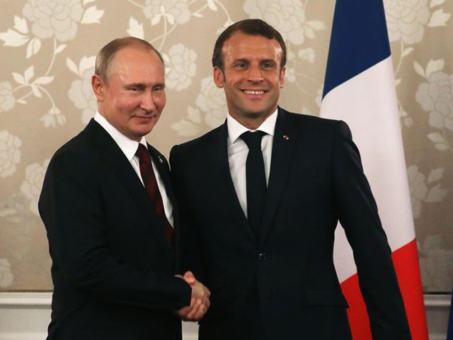 France's President Emmanuel Macron (R) shakes hands with Russia's President Vladimir Putin during a bilateral meeting on the sidelines of the G20 Summit in Osaka on June 28, 2019. (Photo by LUDOVIC MARIN / AFP) (Photo credit should read LUDOVIC MARIN/AFP via Getty Images)