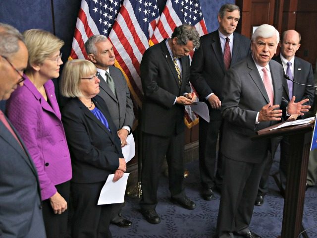WASHINGTON, DC - JULY 21: Former Sen. Chris Dodd (D-CT) (3rd R) speaks during a news conference on the fifth anniversary of the Dodd-Frank Wall Street Reform and Consumer Protection Act with (L-R) Sen. Chuck Schumer (D-NY), Sen. Elizabeth Warren (D-MA), Sen. Patty Murray (D-WA), Sen. Jack Reed (D-RI), Sen. …