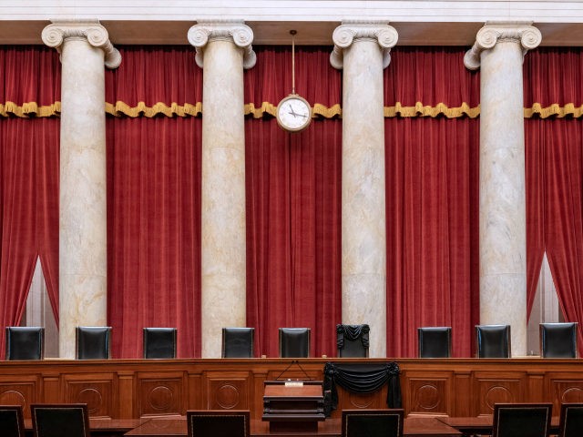 In this handout photo provided by the Supreme Court of the United States, the bench and seat of Associate Justice Ruth Bader Ginsburg is draped in black cloth after her death, on September 19, 2020 in Washington, D.C. Ginsburg was appointed to the Court by President Bill Clinton in 1993. …