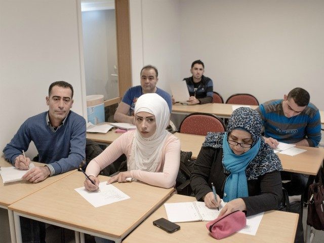 HALMSTAD, SWEDEN - FEBRUARY 08: Asylum seekers from Syria and Irak attend a Swedish language class at the Halmstad University on February 8, 2016 in Halmstad, Sweden. Last year Sweden received 162,877 asylum applications, more than any European country proportionate to its population. According to the Swedish Migration Agency, Sweden …