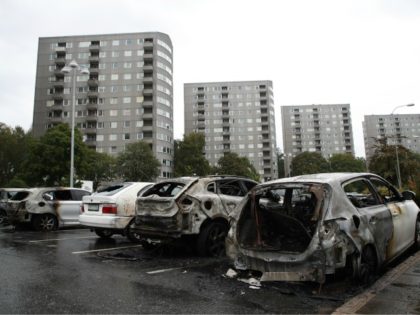 Burned cars are pictured at Froelunda Square in Gothenburg, Sweden on August 14, 2018. - Up to 80 cars have been set on fire in western Sweden by masked vandals, police said on August 14, 2018, in what was described as organised crime weeks before the general election. Most of …
