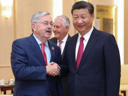 BEIJING, CHINA - SEPTEMBER 30: U.S. Ambassador Terry Edward Branstad (L) shakes hands with