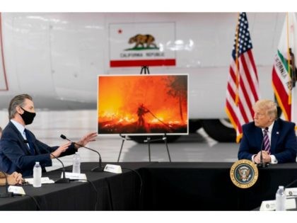 President Donald Trump participates in a briefing on wildfires with Calif. Gov. Gavin Newsom, left, at Sacramento McClellan Airport, in McClellan Park, Calif., Monday, Sept. 14, 2020. (AP Photo/Andrew Harnik)