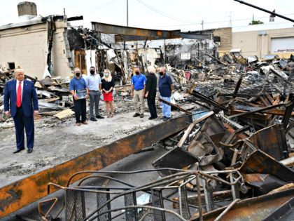 US President Donald Trump tours an area affected by civil unrest in Kenosha, Wisconsin on