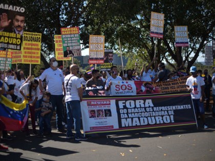 BRASILIA, BRAZIL - JULY 05: Supporters of Venezuelan opposition leader Juan Guaido attend a protest against Venezuela's President Nicolas Maduro during their country's independence day celebration next to the Venezuelan embassy amidst the coronavirus (COVID-19) pandemic on July 5, 2020 in Brasilia, Brazil. (Photo by Andre Borges/Getty Images)