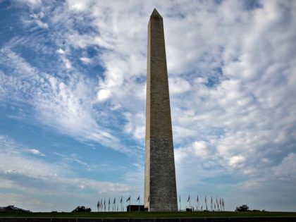 WASHINGTON, DC - JULY 19: The flags at Washington Monument are at full staff on July 19, 2020 in Washington, DC. Rep. John Lewis, died at 80 years old, was an icon leader in the civil rights moment and the Voting Rights Act and served as a United States Congressman …