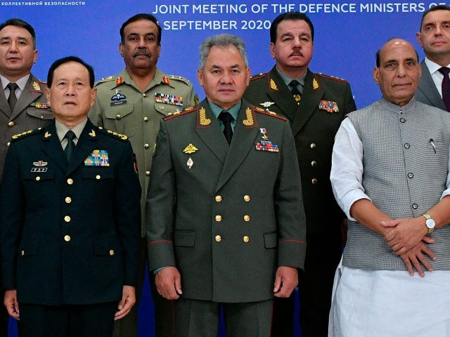 China's Minister of National Defence Wei Fenghe, left, Russian Defense Minister Sergei Shoigu, center, and Indian Defense Minister, Rajnath Singh, right, pose for a photo with their colleagues at a Joint Meeting of Defense Ministers of Shanghai Cooperation Organisation, Commonwealth of Independent States and Collective Security Treaty Organization Member States …