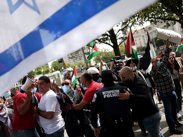WASHINGTON, DC - SEPTEMBER 15: Protesters from multiple Palestinian rights organizations scuffle with a pro-Israel group outside the White House on September 15, 2020 in Washington, DC. The groups gathered to protest the signing of the Abraham Accords that will normalize relations between Israel, Bahrain and the United Arab Emirates. (Photo by Win McNamee/Getty Images)
