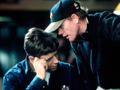 401864 09: (EDITORIAL USE ONLY, COPYRIGHT MCA/UNIVERSAL PICTURES) Director Ron Howard speaks with actor Russell Crowe on the set of the film "A Beautiful Mind." (Photo by MCA/Universal Pictures/Getty Images)