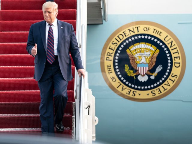 President Donald J. Trump waves and gives a thumbs-up as he disembarks Air Force One Tuesd