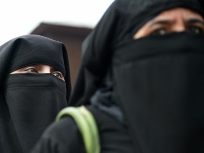 TOPSHOT - Kashmiri burqa-clad women are pictured during a strike in Srinagar's Maisuma are