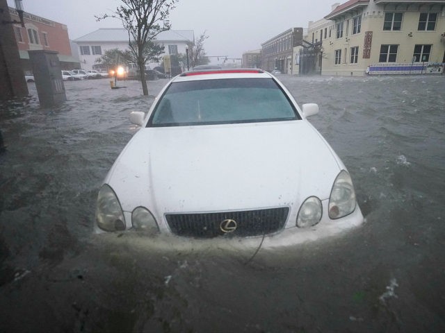 Floos waters move on the street, Wednesday, Sept. 16, 2020, in Pensacola, Fla. Hurricane S