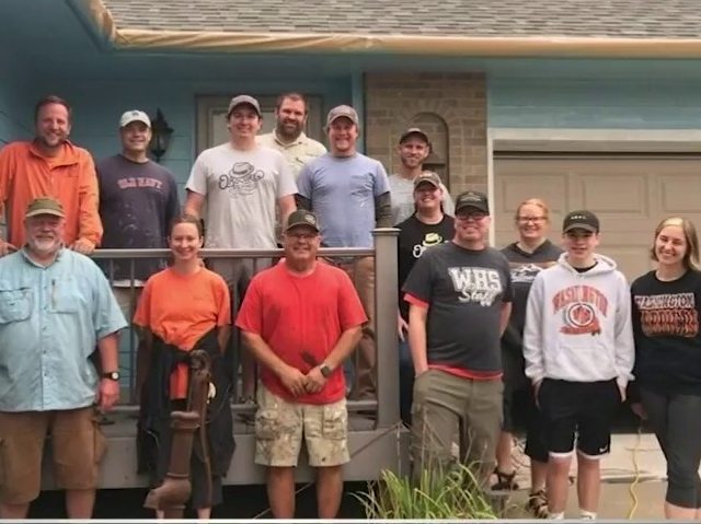 Dozens of people came out to help repaint the house of a 45-year-old former teacher from S
