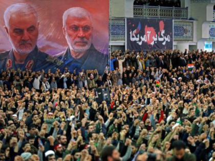 In this picture released by the official website of the office of the Iranian supreme leader, worshippers chant slogans during Friday prayers ceremony, as a banner show Iranian Revolutionary Guard Gen. Qassem Soleimani, left, and Iraqi Shiite senior militia commander Abu Mahdi al-Muhandis, who were killed in Iraq in a …