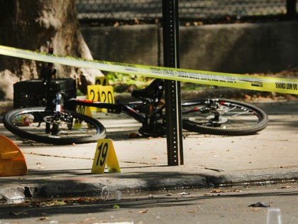 NEW YORK, NEW YORK - JULY 13: Police ballistic markers stand besides a child's bicycle at a crime scene in Brooklyn where a one year old child was shot and killed on July 13, 2020 in New York City. The 1-year-old boy was shot near a playground during a Sunday …