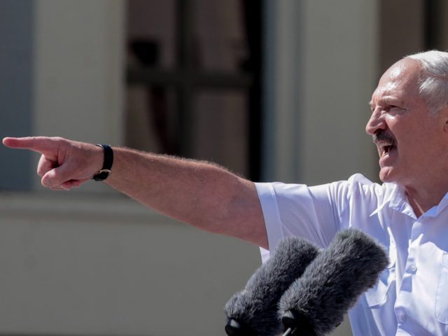 Belarus' President Alexander Lukashenko gestures as he delivers a speech during a rally held to support him in central Minsk, on August 16, 2020. - The Belarusian strongman, who has ruled his ex-Soviet country with an iron grip since 1994, is under increasing pressure from the streets and abroad over …