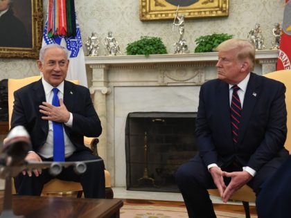 US President Donald Trump watches as Israeli Prime Minister Benjamin Netanyahu, speaks during a bilateral meeting in the Oval Office of the White House in Washington, DC, September 15, 2020. - Israeli Prime Minister Benjamin Netanyahu and the foreign ministers of Bahrain and the United Arab Emirates arrived September 15, …