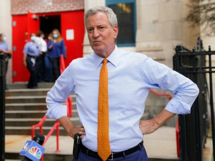 New York Mayor Bill de Blasio speaks to reporters after visiting New Bridges Elementary Sc
