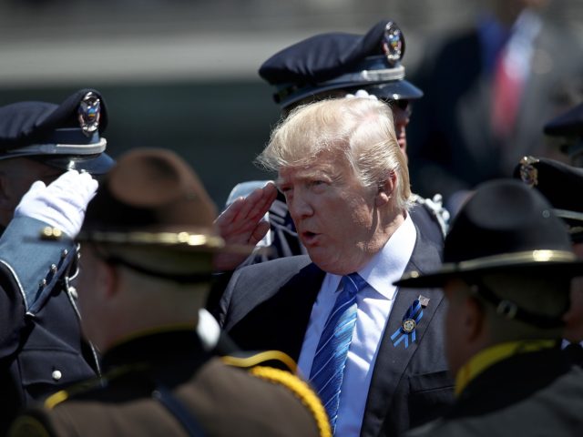 WASHINGTON, DC - MAY 15: U.S. President Donald Trump salutes police officers as he arrives at the 36th annual National Peace Officers' Memorial Service at the U.S. Capitol on May 15, 2017 in Washington, DC. The service is part of National Police Week and honors police officers across the country, …