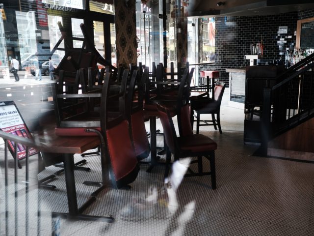 NEW YORK, NEW YORK - AUGUST 31: Chairs are piled-up inside of a closed restaurant in Manhattan on August 31, 2020 in New York City. While New York City restaurants are currently permitted to serve take-out and to offer sidewalk dining, they are not allowed to offer indoor dining due …