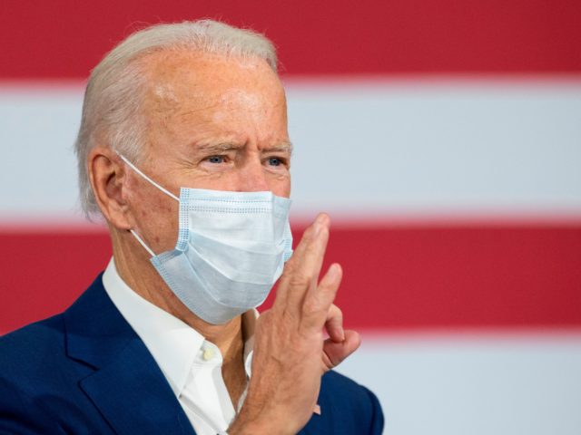 TOPSHOT - Democratic Presidential Candidate Joe Biden makes a zero with his hand as he delivers remarks at an aluminum manufacturing facility in Manitowoc, Wisconsin, on September 21, 2020. (Photo by JIM WATSON / AFP) (Photo by JIM WATSON/AFP via Getty Images)