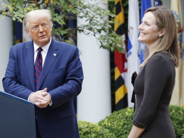 US President Donald J. Trump introduces Judge Amy Coney Barrett (R) as his nominee to be an Associate Justice of the Supreme Court during a ceremony in the Rose Garden of the White House in Washington, DC, on Saturday, September 26, 2020. Judge Barrett, if confirmed, will replace the late …