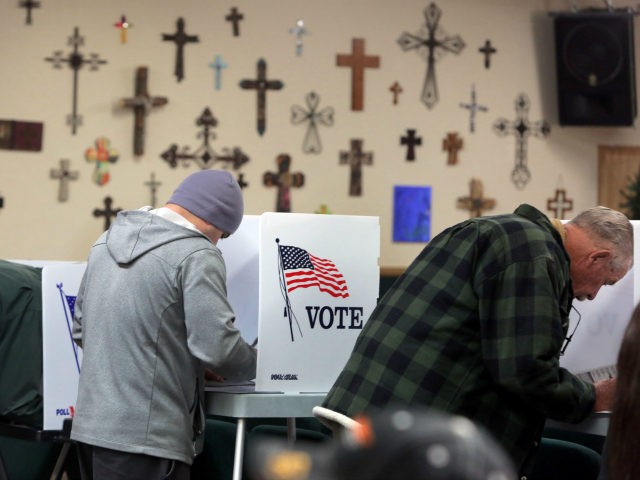 People vote at a polling station in the Summit Christian Fellowship in Big Bear, Californi