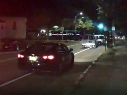 Police respond to the scene of a shooting early Saturday, Sept. 19, 2020 in Rochester, N.Y. As many as 100 people were at a backyard party when the shooting started just before 12:30 a.m., Acting Police Chief Mark Simmons told reporters. (13 WHAM via AP)