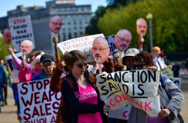 Protesters with the activist group Code Pink demonstrate outside the White House to call a