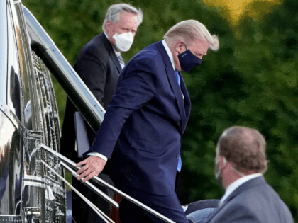 In this Friday, Oct. 2, 2020, file photo, President Donald Trump steps down from Marine One as he arrives at Walter Reed National Military Medical Center in Bethesda, Md., after he tested positive for COVID-19. White House chief of staff Mark Meadows is in the background. The president’s coronavirus infection, …