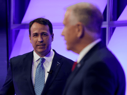 Democratic challenger Cal Cunningham, left, and U.S. Sen. Thom Tillis, R-N.C. talk during a televised debate Thursday, Oct. 1, 2020 in Raleigh, N.C. (AP Photo/Gerry Broome, Pool)
