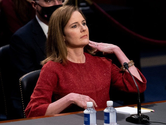 Supreme Court nominee Amy Coney Barrett listens during a confirmation hearing before the S