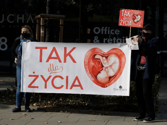 Anti-abortion activists attend a protest in front of Poland's constitutional court, in Warsaw, Poland, Thursday, Oct. 22, 2020. Poland’s top court has ruled that a law allowing abortion of fetuses with congenital defects is unconstitutional. The decision by the country’s Constitutional Court effectively bans terminating pregnancies in cases where birth …
