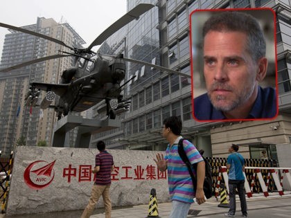 (INSET: Hunter Biden) Passersby look at a life size replica of the Chinese Army Z-10WZ attack helicopter displayed outside the office of China's main state-owned aircraft maker AVIC (Aviation Industry Corporation), China's leading aircraft manufacturer in Beijing, China Thursday, July 17, 2014. China's military spending has increased substantially almost every …