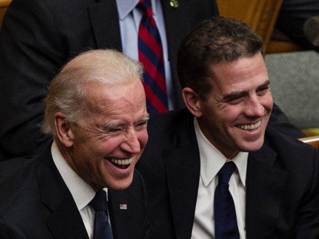 From right, Tom Daschle, Hunter Biden, Vice President Joe Biden, and daughters of George McGovern Ann McGovern and Susan Rowen, laugh as they listen to Matt McGovern, grand son of George McGovern, at a prayer service for the former Democratic U.S. senator and three-time presidential candidate George McGovern at the …