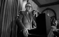 ** FILE ** In this Oct. 26, 1972 file photo, then presidential adviser Dr. Henry Kissinger tells a White House news conference that "peace is at hand in Vietnam. (AP Photo)