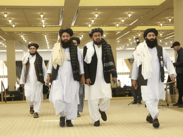 In this Feb. 29, 2020, file, photo, Afghanistan's Taliban delegation arrive for the agreem