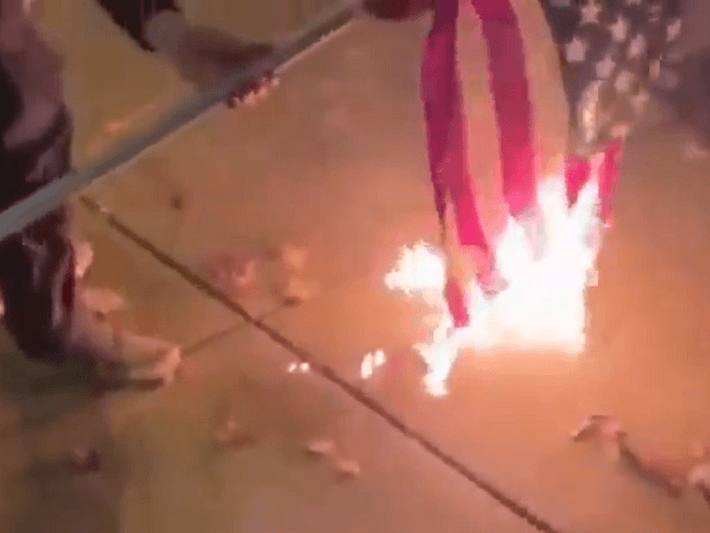 Antifa burns an American flag after stealing it from a pickup truck in Vancouver, Washington. (Twitter Video Screenshot)