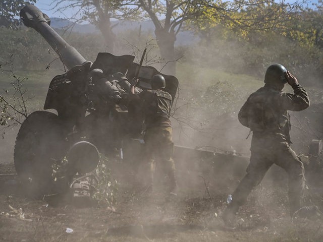 Armenian soldiers fire artillery on the front line on October 25, 2020, during the ongoing fighting between Armenian and Azerbaijani forces over the breakaway region of Nagorno-Karabakh. - The head of a Red Cross mission monitoring the Nagorno-Karabakh conflict called on October 22, 2020 for all parties to stop shelling …