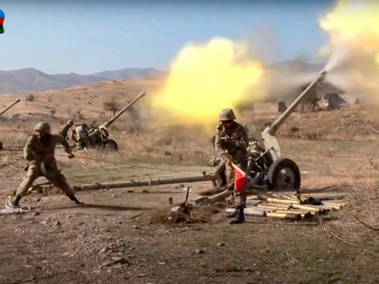 In this image taken from video released by Azerbaijan's Defense Ministry on Tuesday, Oct. 20, 2020, Azerbaijan army soldiers fire an artillery piece during fighting with forces of the self-proclaimed Republic of Nagorno-Karabakh. Azerbaijan Defense Ministry claims that Armenian forces tried to carry out an offensive that was met by …