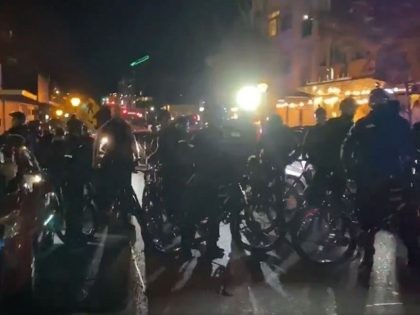 Protesters in black bloc take to streets of Seattle suburbs. (Twitter Video )Screenshot/Katie Daviscourt)