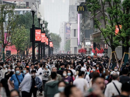 WUHAN, CHINA - OCTOBER 02: People tour in a shopping street during the national holiday on