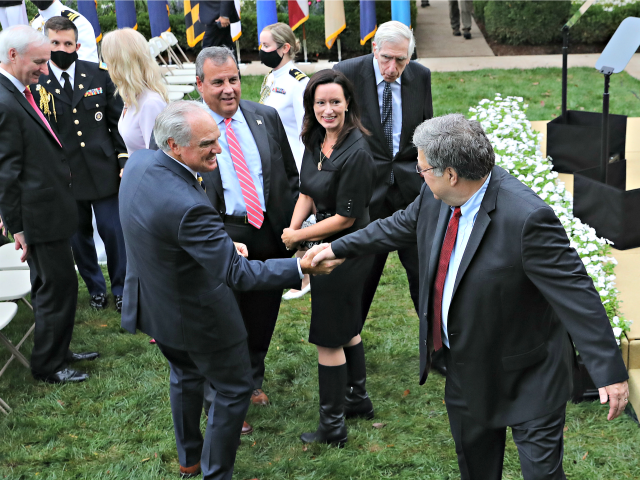 WASHINGTON, DC - SEPTEMBER 26: Attorney General William Barr (R) says goodbye to former Ne