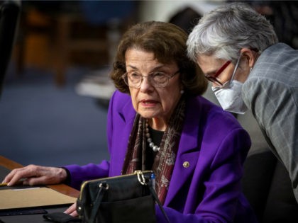 Ranking member U.S. Sen. Dianne Feinstein (D-CA) speaks with a staff member during the fou