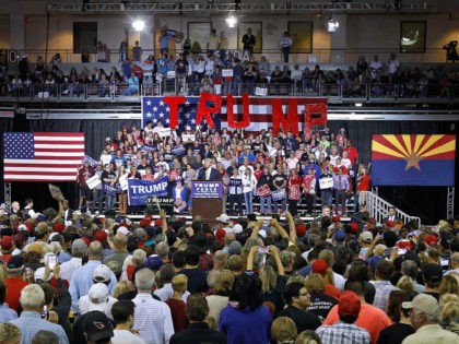 Republican presidential nominee Donald Trump speaks to a crowd of supporters during a camp