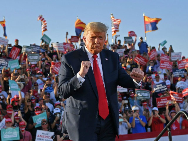 US President Donald Trump dances as he leaves a rally at Tucson International Airport in Tucson, Arizona on October 19, 2020. - US President Donald Trump went after top government scientist Anthony Fauci in a call with campaign staffers on October 19, 2020, suggesting the hugely respected and popular doctor …