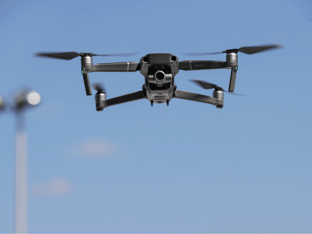 NEW YORK, NY - AUGUST 23: A new DJI Mavic Zoom drone flies during a product launch event at the Brooklyn Navy Yard, August 23, 2018 in New York City. DJI announced the release of two new drones, the Mavic 2 Pro and the Mavic 2 Zoom, which includes a …