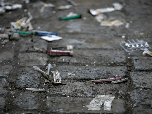WALSALL, ENGLAND - DECEMBER 06: Syringes and paraphernalia used by drug users litter an al